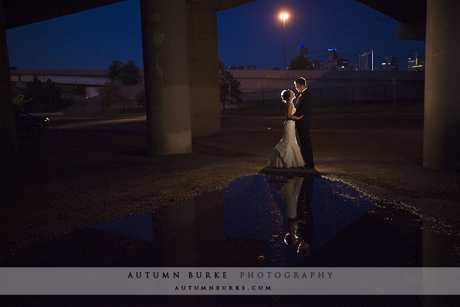 denver colorado mile high station wedding at night reflection puddle city lights