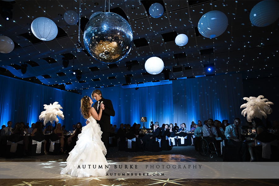 seawell ballroom denver wedding first dance blue decor feathers lighting 