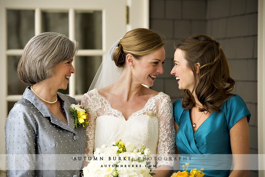 denver country club winter wedding bride laughing with sister bridesmaid and mom