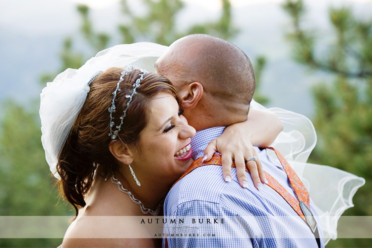 joy laughter bride and groom embrace colorado wedding mt vernon