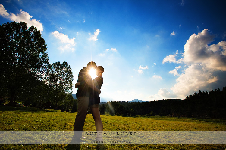 colorado bluebird sky silhouette sun lake evergreen mountain engagement