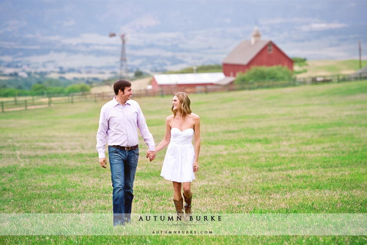 colorado farm wedding engagement session fields and barn and cowboy boots