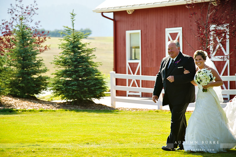 crooked willow wedding ceremony colorado barn father walking bride down the aisle