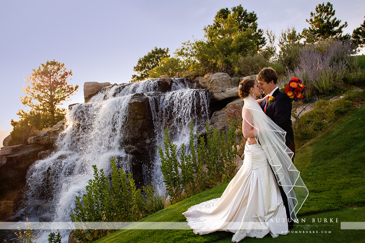 the sanctuary golf course sedalia colorado wedding bride and groom waterfall