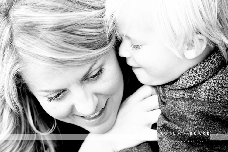 baby whispering to mom black and white portrait denver colorado family portrait