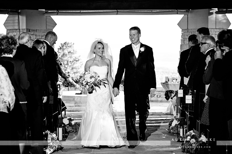 sanctuary colorado wedding ceremony sedlia classic bride and groom walk down the aisle 