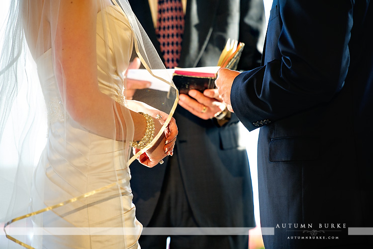 bride and groom exchange rings the sanctuary wedding ceremony sedalia colorado