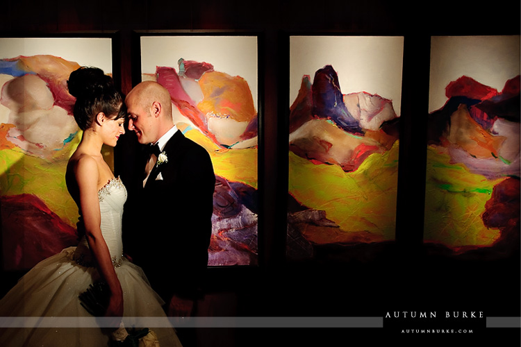 bride and groom in front of the art at the four seasons vail colorado