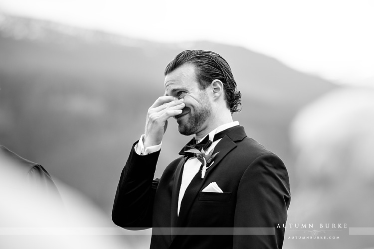 emotional groom seeing his bride walk down the aisle during devils thumb ranch wedding ceremony