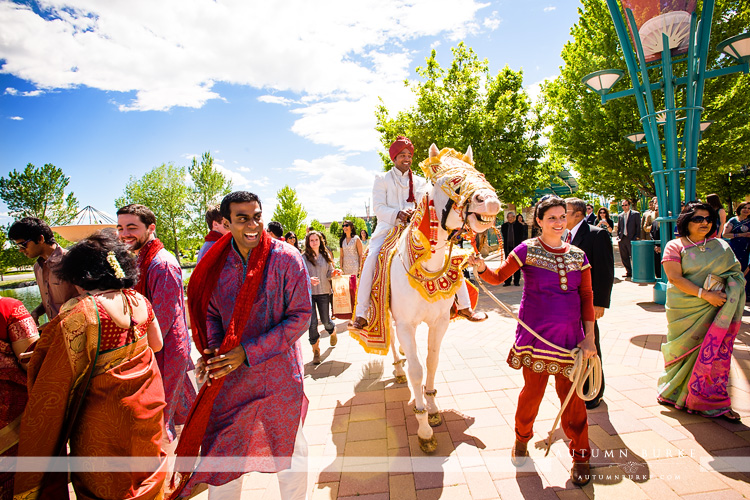 colorado indian wedding grooms processional white horse