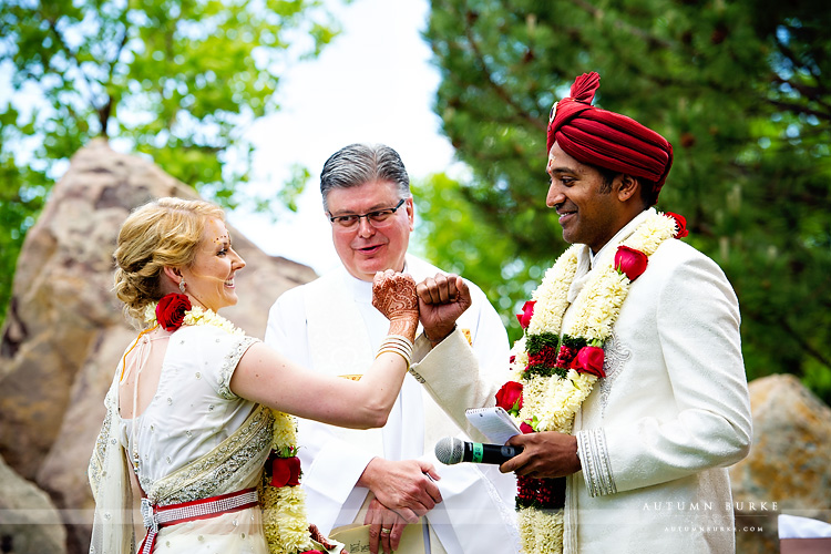 hindu christian wedding ceremony fist bump bride and groom