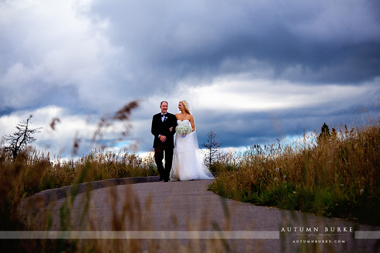 father of bride walks daughter down the aisle vail wedding deck ceremony colorado mountain