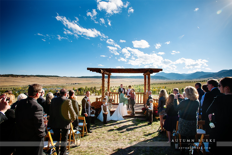 spruce mountain ranch wedding ceremony larkspur colorado mountain backdrop