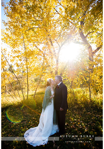 spruce mountain ranch sunkissed bride and groom colorado rustic wedding revel and bloom 