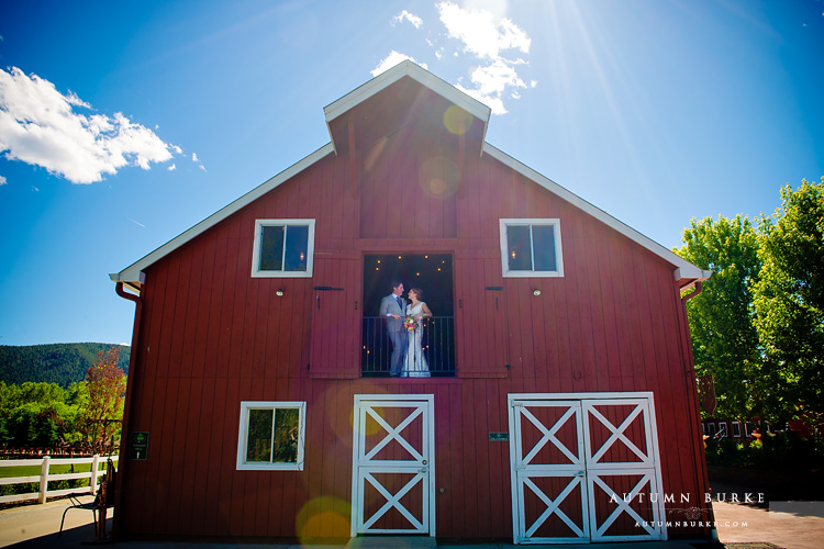 crooked willow farms wedding bride and groom in barn larkspur colorado