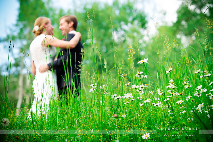 beaver creek saddle ridge wedding colorado mountain wedding bride and groom field wildflowers