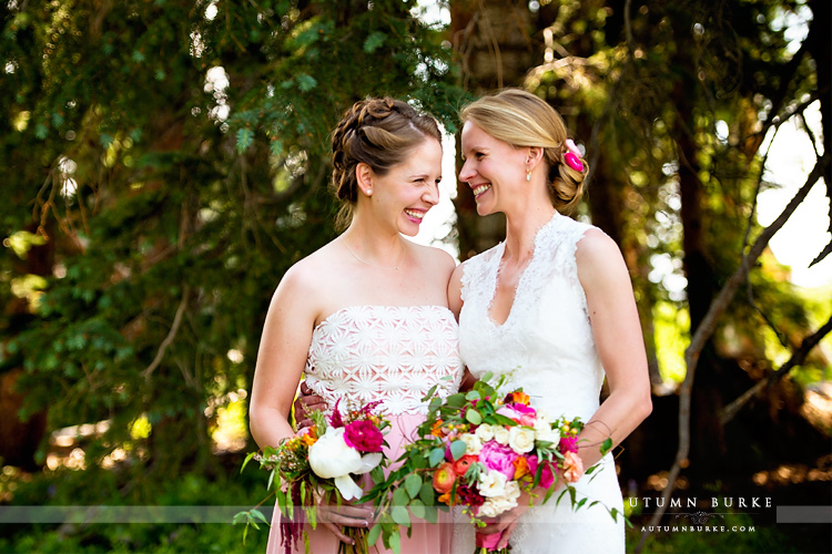 beaver creek saddle ridge wedding colorado mountain wedding deck bride and sister maid of honor laughing