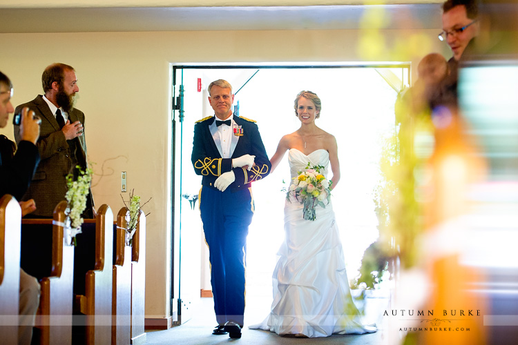 beaver creek wedding ceremony beaver creek chapel colorado mountain bride and dad walk down aisle