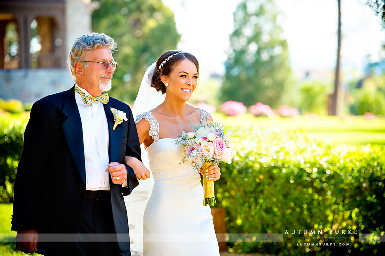 colorado highlands ranch mansion wedding ceremony dad walks bride down aisle