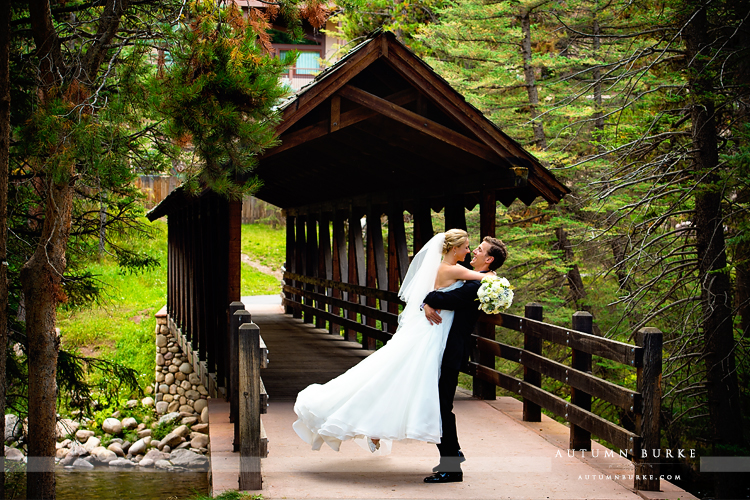 vail colorado mountain wedding donovan pavillion bride and groom first look bridge