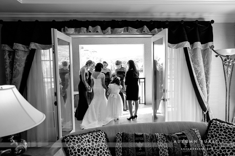 bride and bridesmaids pray before ceremony the broadmoor colorado wedding