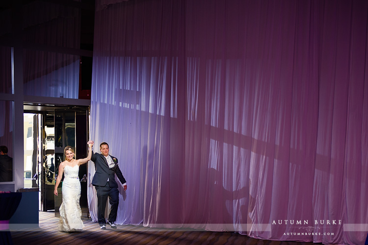 wedding reception seawell ballroom dcpa denver colorado grand entrance bride and groom