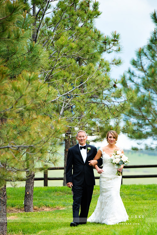 bride walking down aisle with dad spruce mountain ranch wedding ceremony graces chapel larkspur colorado