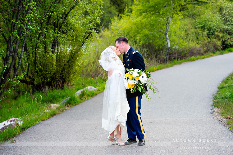 colorado mountain wedding beaver creek westin bride and groom by river