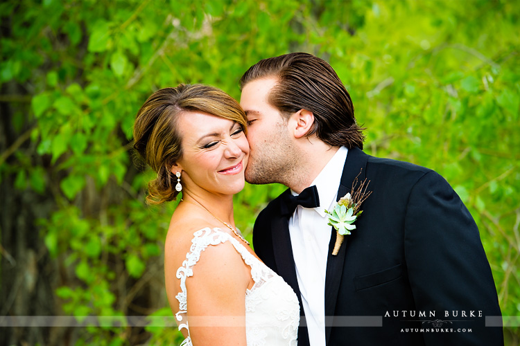 spruce mountain ranch colorado wedding bride and groom nose squinch