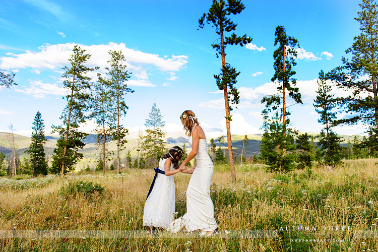 wild horse inn winter park colorado mountain wedding bride and flower girl in field