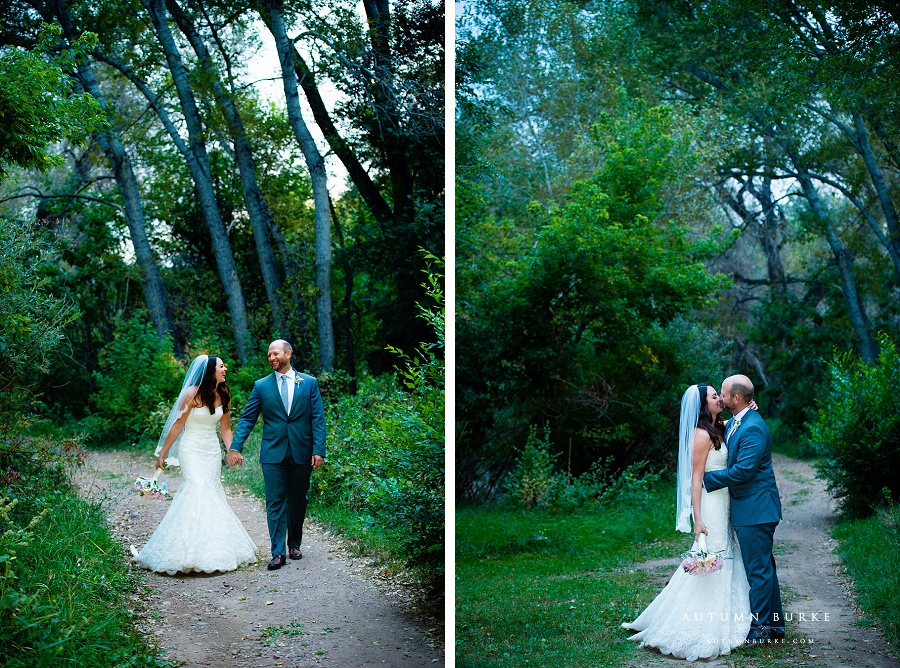 colorado wedding bride and groom walking through woods chatfiled botanic gardens wedding