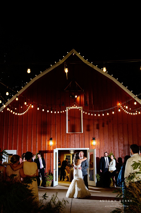 bride and groom first dance in front of barn chatfield botanic gardens outdoor wedding 