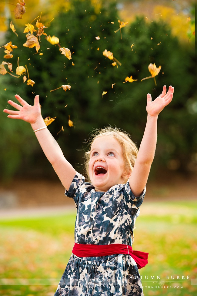 family portraits colorado fall autumn leaves children kids playful