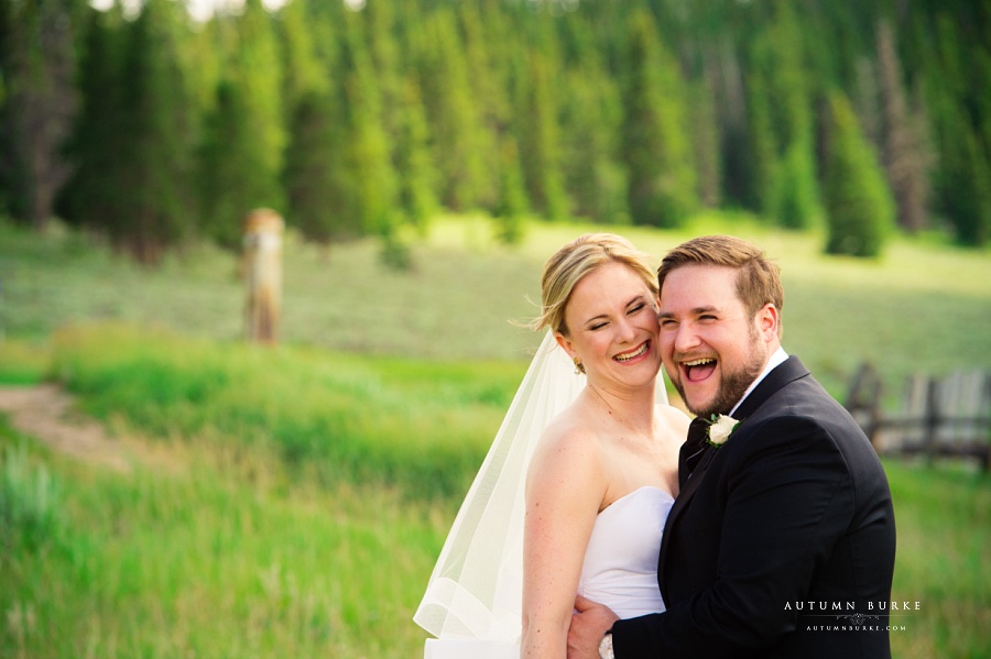 bride and groom candid moment love and laughter keystone ranch wedding colorado