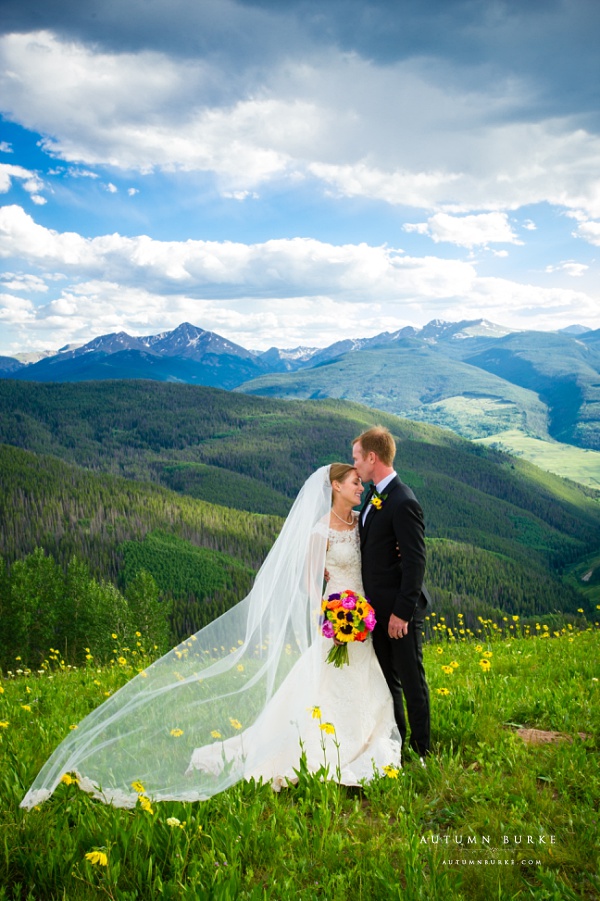 bride and groom mountaintop vail wedding deck ceremony