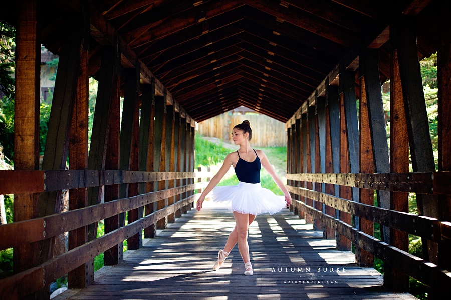 colorado ballerina portrait high school senior pointe shoes bridge outdoors rustic